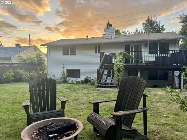 a view of house with backyard outdoor seating area and furniture