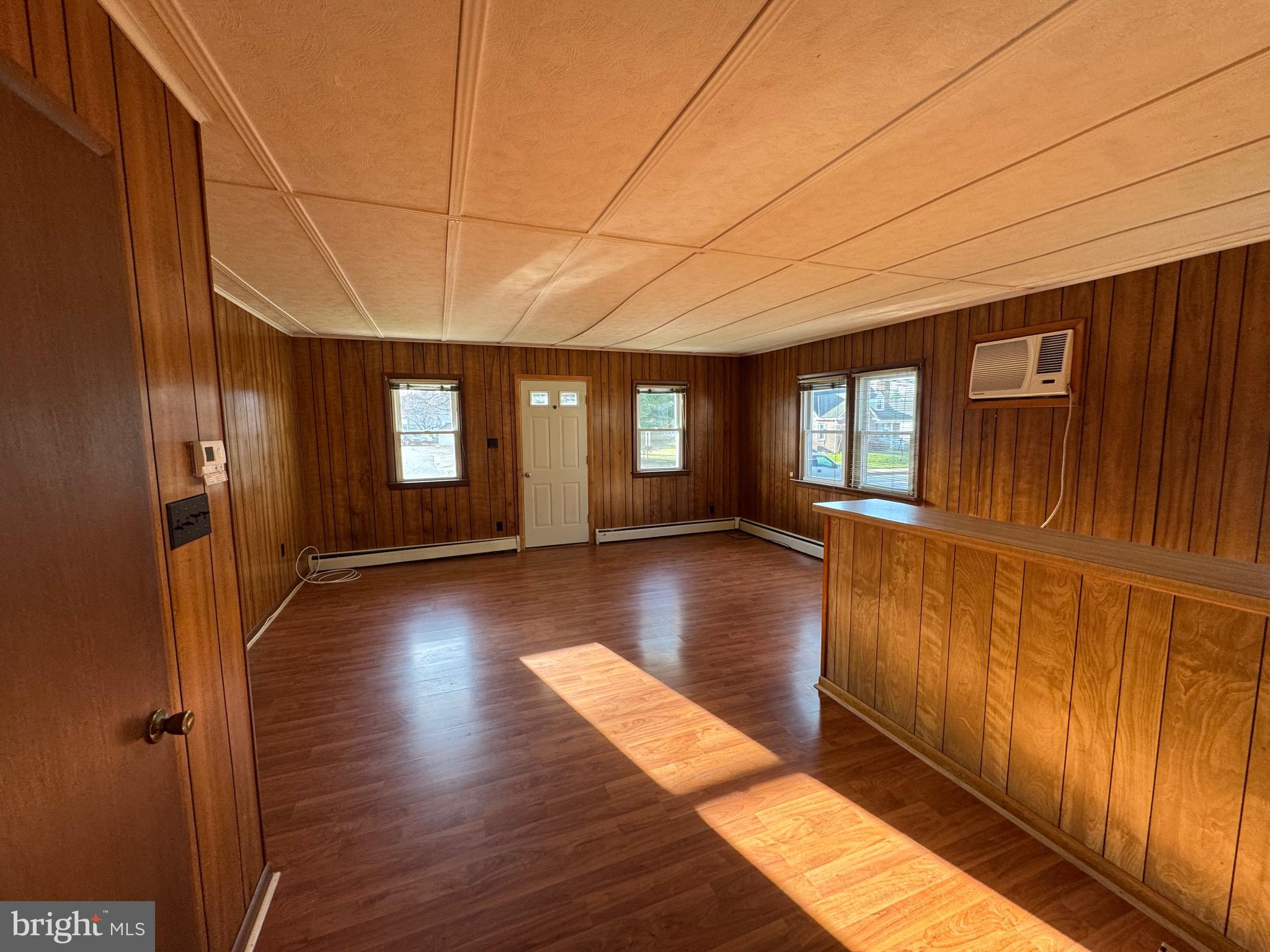 252 West State Street Quarryville, PA 17566 - Photo 3 of 9 a view of empty room with wooden floor and fan