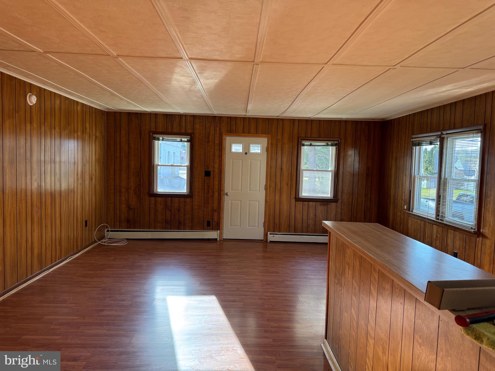 252 West State Street Quarryville, PA 17566 - Photo 4 of 9 a view of an entryway with wooden floor and windows