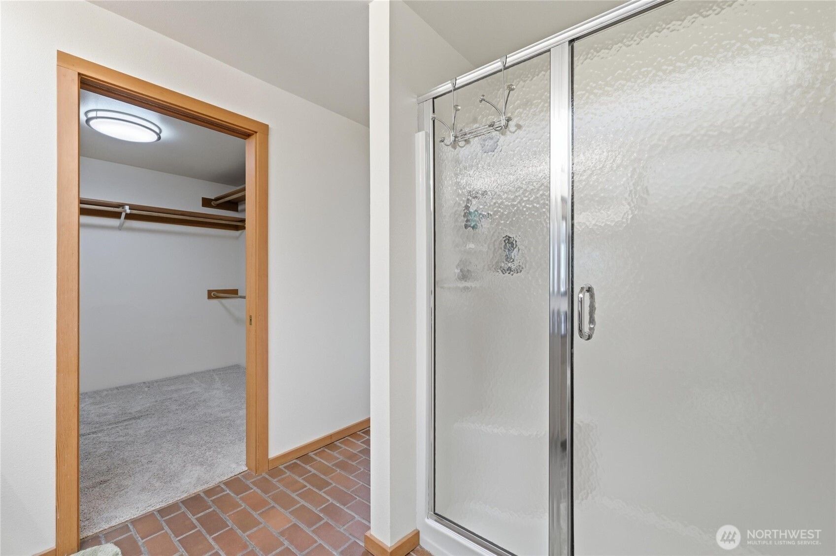 9520 Odin Way Bothell, WA 98011 - Photo 18 of 40 a bathroom with a shower and a mirror