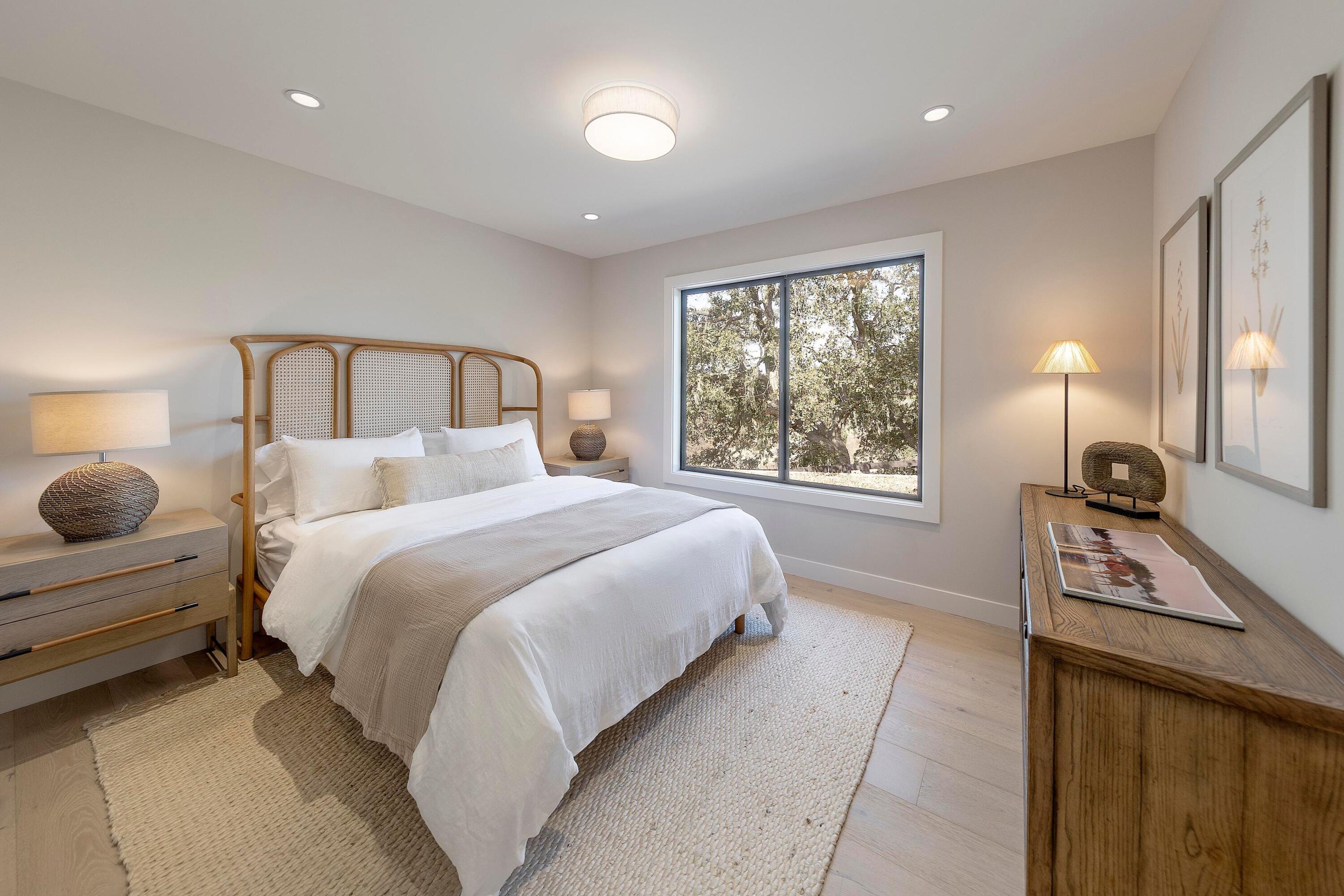3009 Woodstock Road Santa Ynez, CA 93460 - Photo 20 of 32 a bedroom with a bed and a window