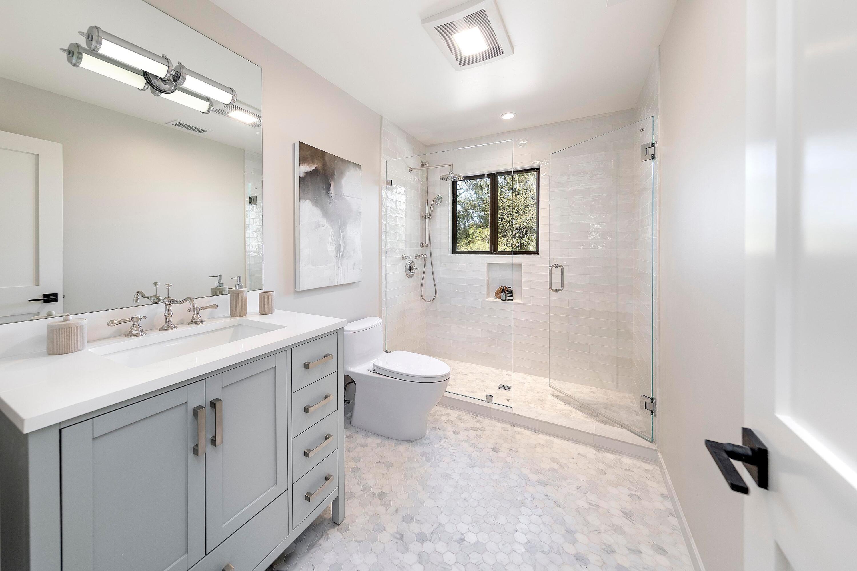 3009 Woodstock Road Santa Ynez, CA 93460 - Photo 21 of 32 a bathroom with a double vanity sink toilet mirror and bathtub