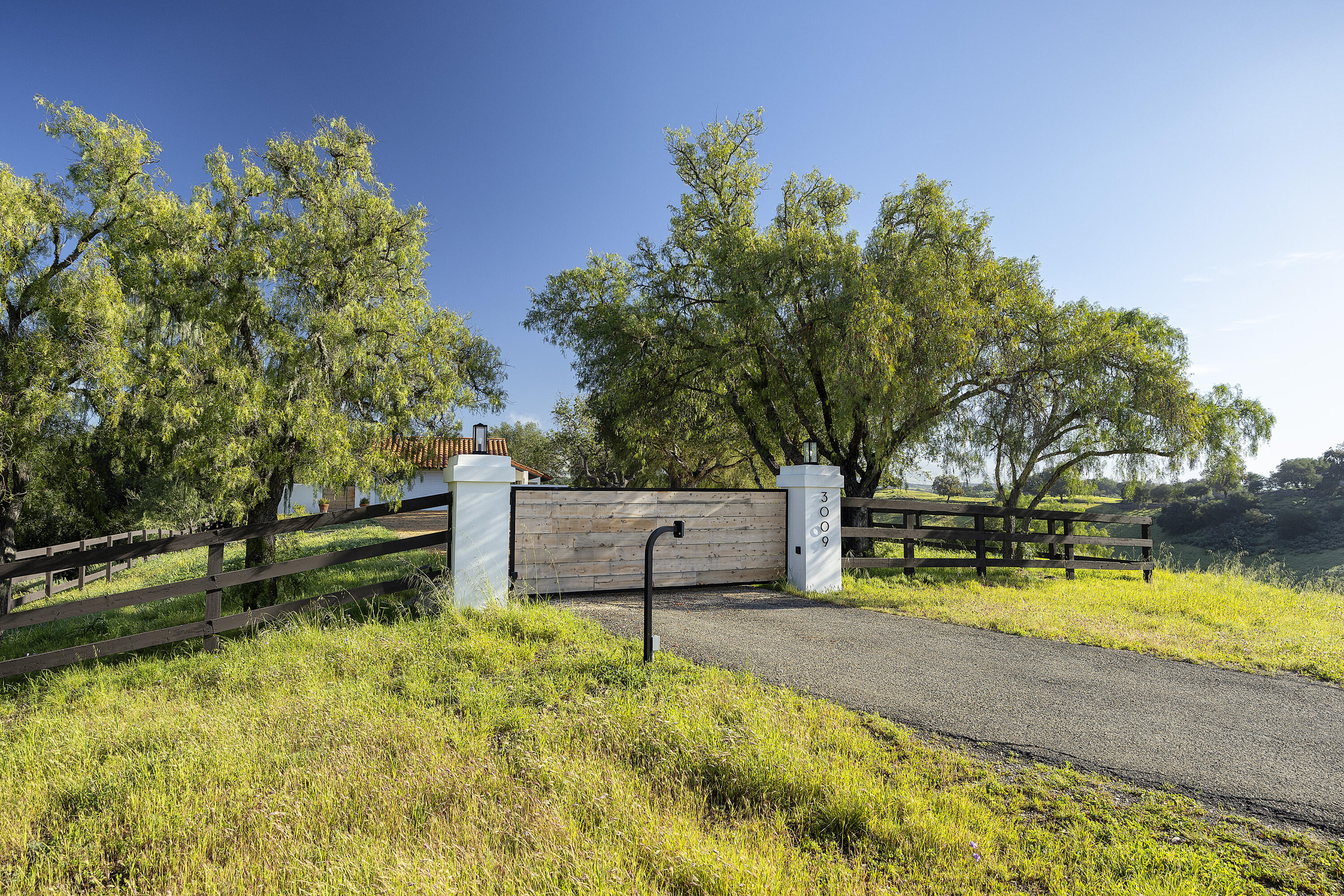 3009 Woodstock Road Santa Ynez, CA 93460 - Photo 27 of 32 a view of swimming pool with a bench and trees