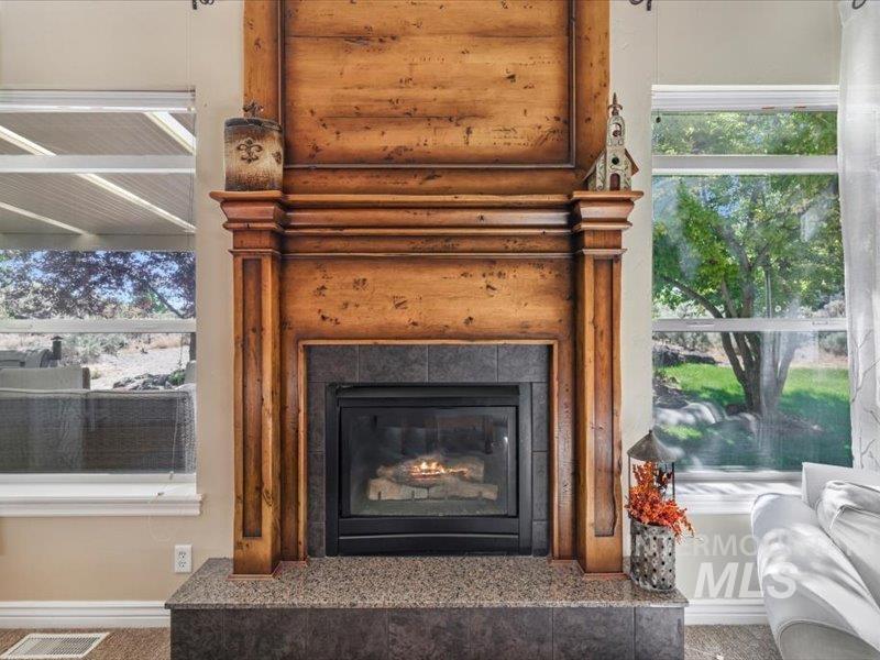 3408 Ridge Line Drive Kimberly, ID 83341 - Photo 11 of 37 Detailed view of a tiled fireplace and baseboards