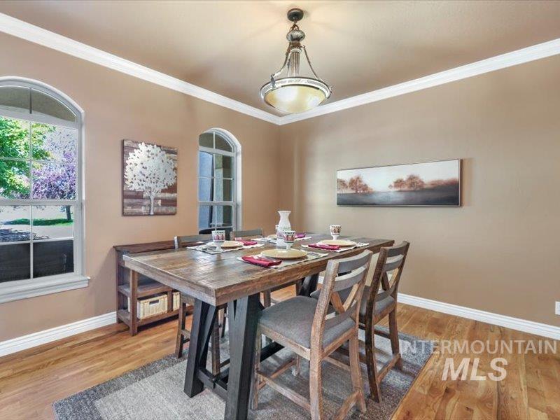 3408 Ridge Line Drive Kimberly, ID 83341 - Photo 15 of 37 Dining space featuring light wood-type flooring and crown molding