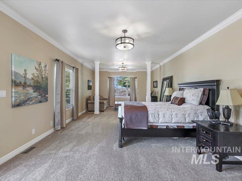 3408 Ridge Line Drive Kimberly, ID 83341 - Photo 23 of 37 Bedroom featuring decorative columns, carpet flooring, and crown molding