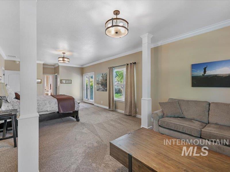 3408 Ridge Line Drive Kimberly, ID 83341 - Photo 25 of 37 Bedroom featuring ornate columns, ornamental molding, and carpet floors
