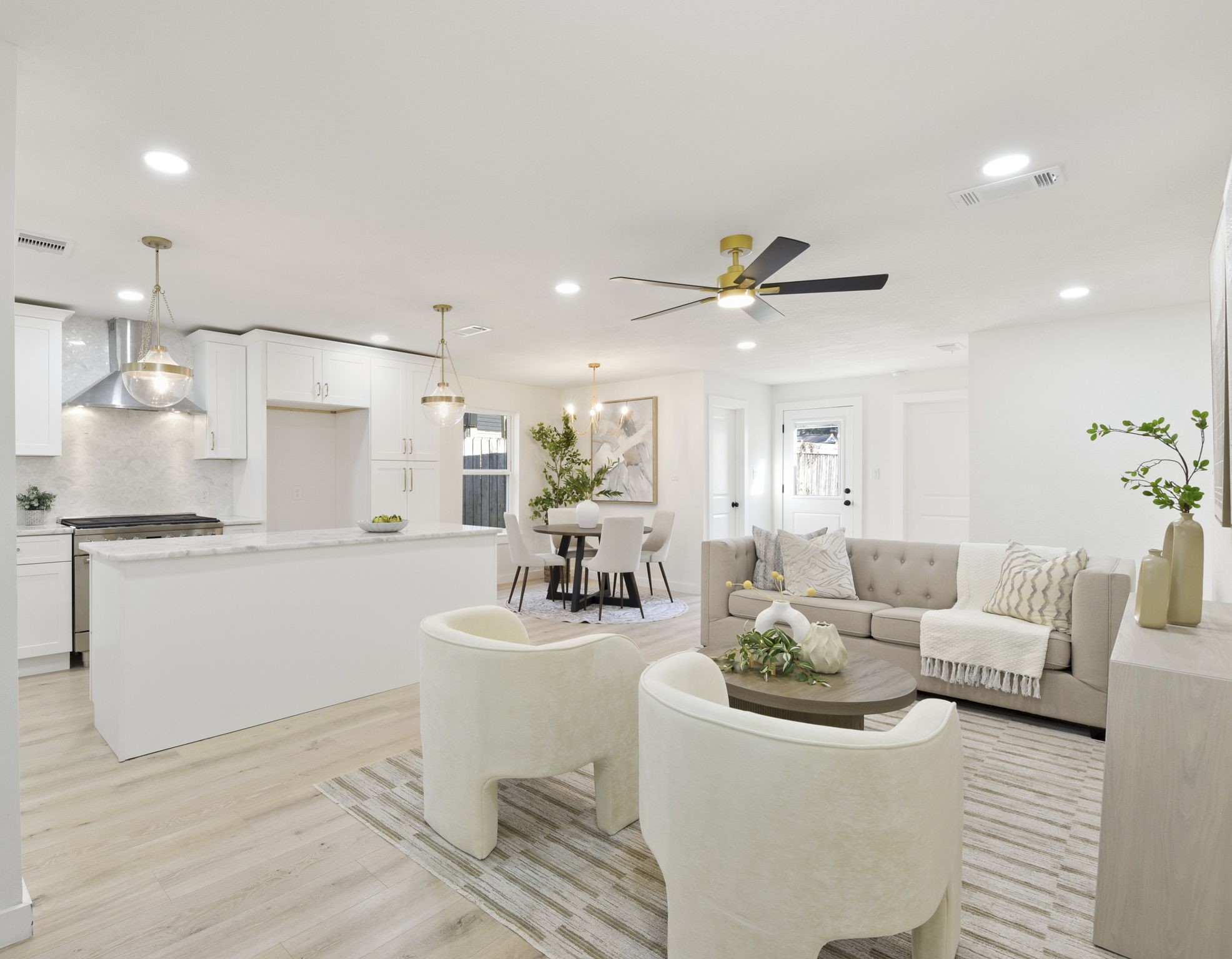 1630 1/2 Tabor Street Houston, TX 77009 - Photo 12 of 28 a living room with furniture and a chandelier