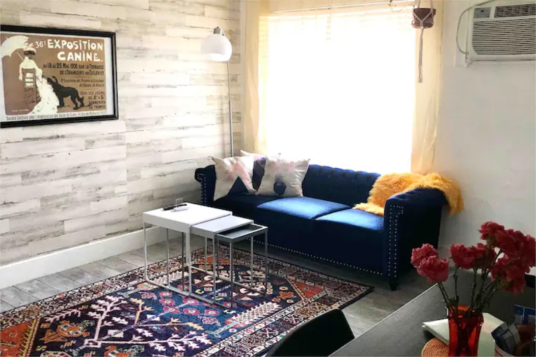 5909 Bolm Road, Unit 12 Austin, TX 78721 - Photo 13 of 15 a living room with furniture and flowers