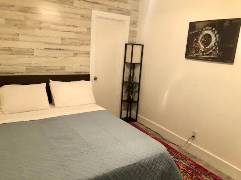 5909 Bolm Road, Unit 12 Austin, TX 78721 - Photo 3 of 15 a bedroom with a bed and a window