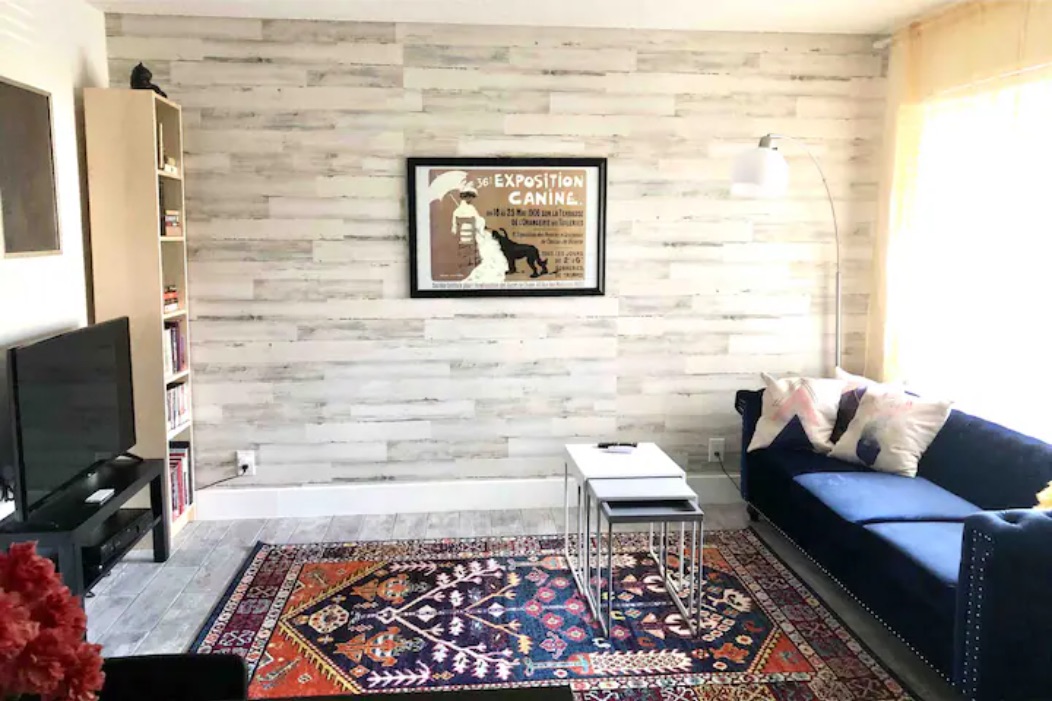 5909 Bolm Road, Unit 12 Austin, TX 78721 - Photo 5 of 15 a living room with furniture and a rug