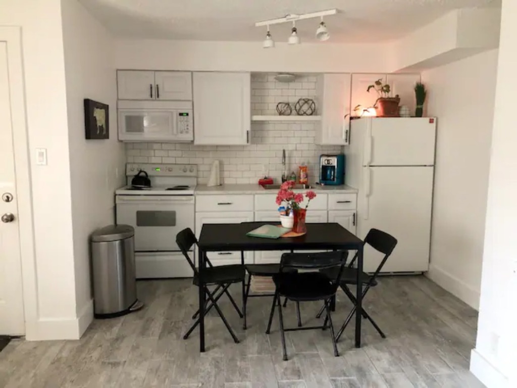 5909 Bolm Road, Unit 12 Austin, TX 78721 - Photo 7 of 15 a view of kitchen with dining table and chairs