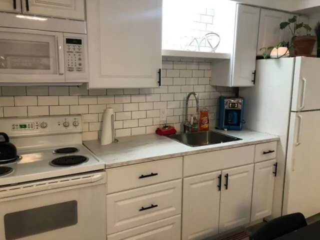 a view of kitchen with dining table and chairs
