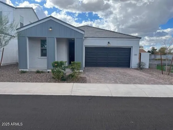 a front view of a house with yard
