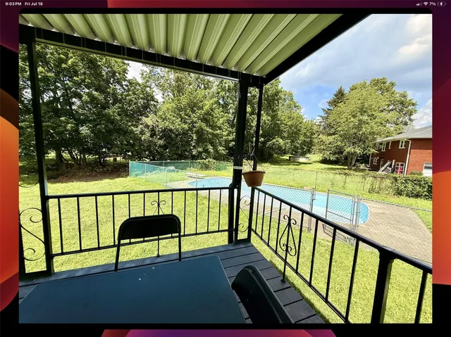 a view of a livingroom with furniture