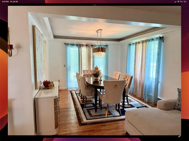 a dining room with furniture and window