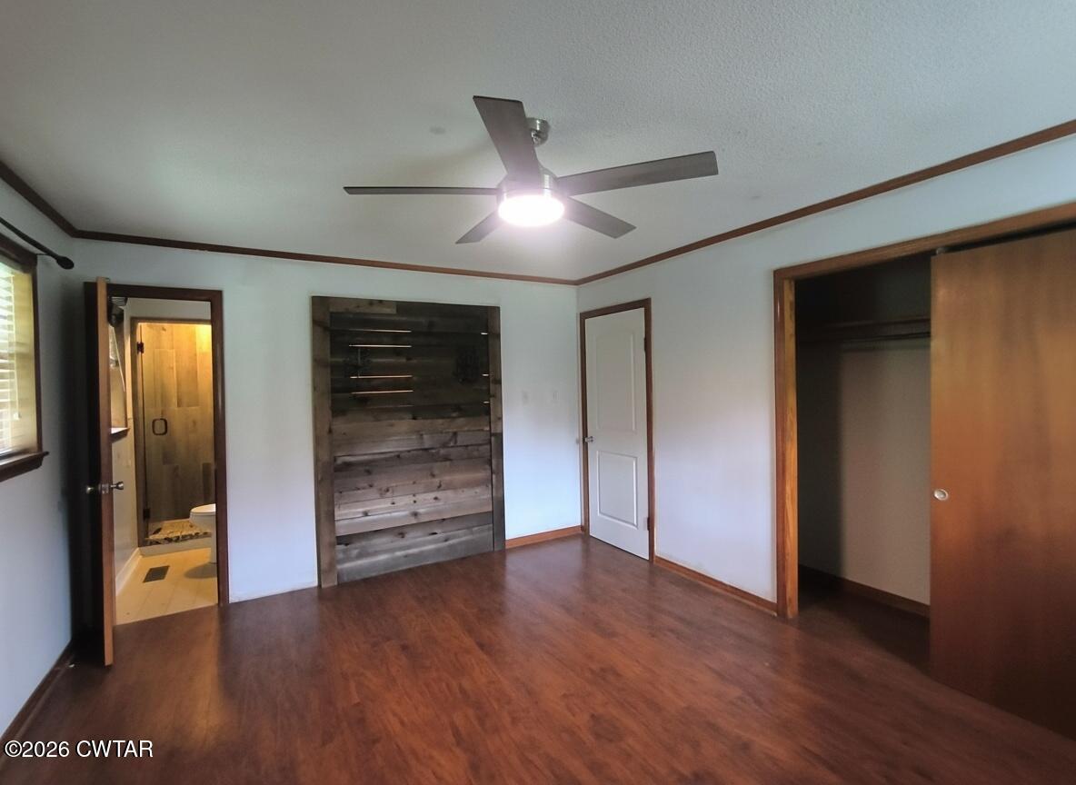 513 Viar Road Dyersburg, TN 38024 - Photo 24 of 37 a view of an empty room with wooden floor and a window