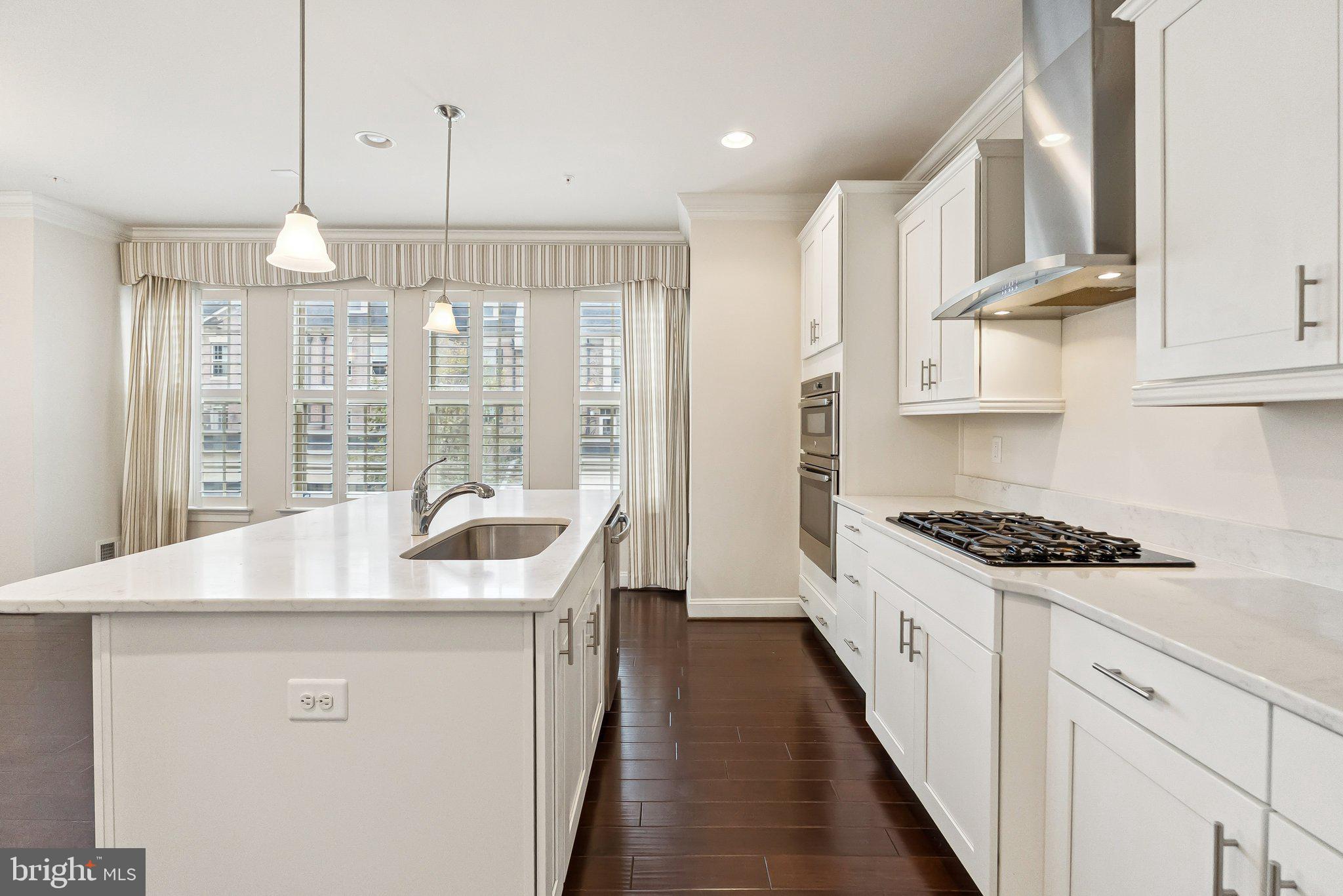 608 Fair Winds Way, Unit 262A Oxon Hill, MD 20745 - Photo 13 of 48 a kitchen with stainless steel appliances granite countertop a sink stove and refrigerator
