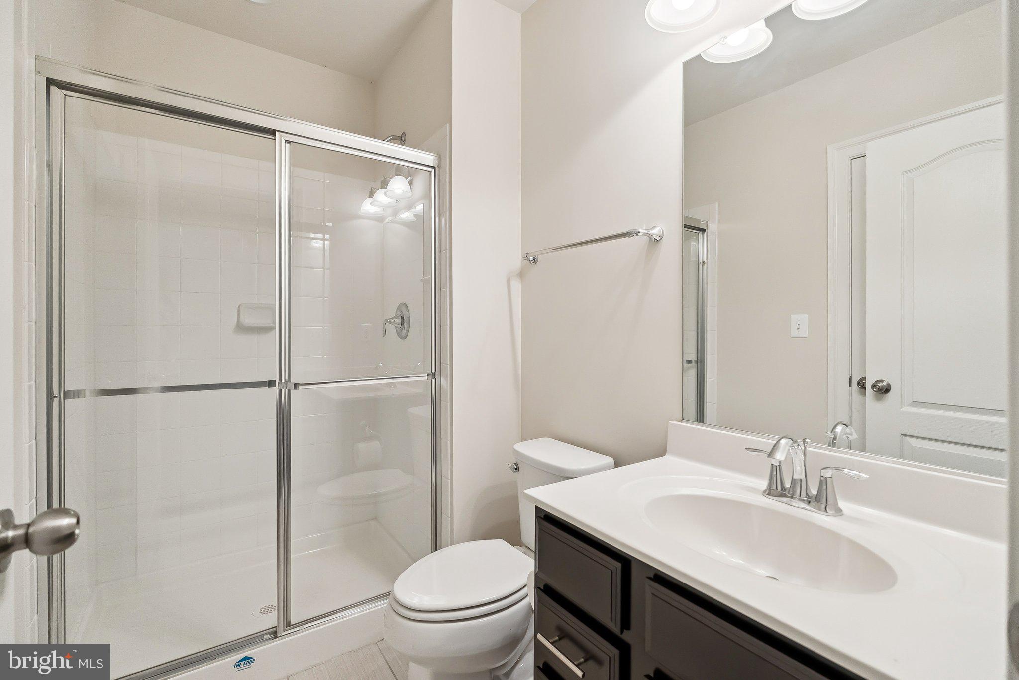 608 Fair Winds Way, Unit 262A Oxon Hill, MD 20745 - Photo 18 of 48 a bathroom with a sink toilet and shower