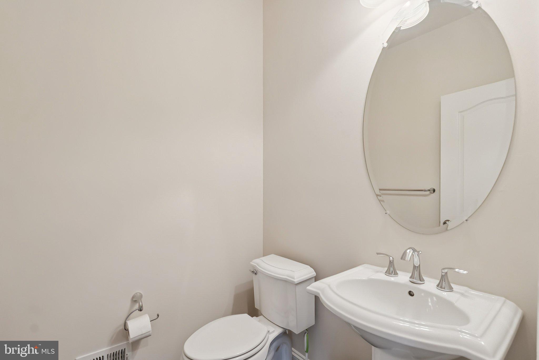 608 Fair Winds Way, Unit 262A Oxon Hill, MD 20745 - Photo 20 of 48 a bathroom with a sink mirror and toilet