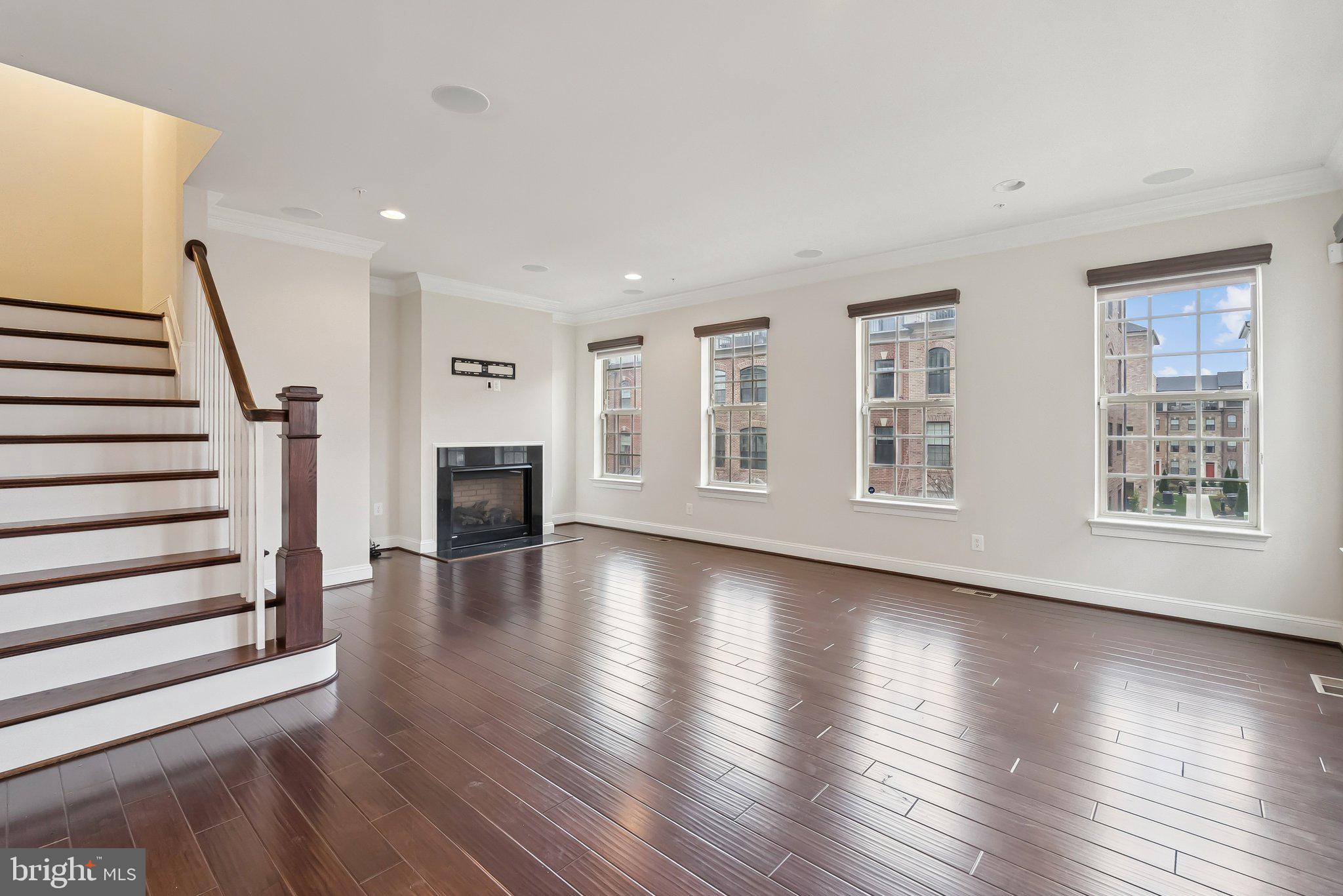 608 Fair Winds Way, Unit 262A Oxon Hill, MD 20745 - Photo 2 of 48 a view of an empty room with wooden floor and a window