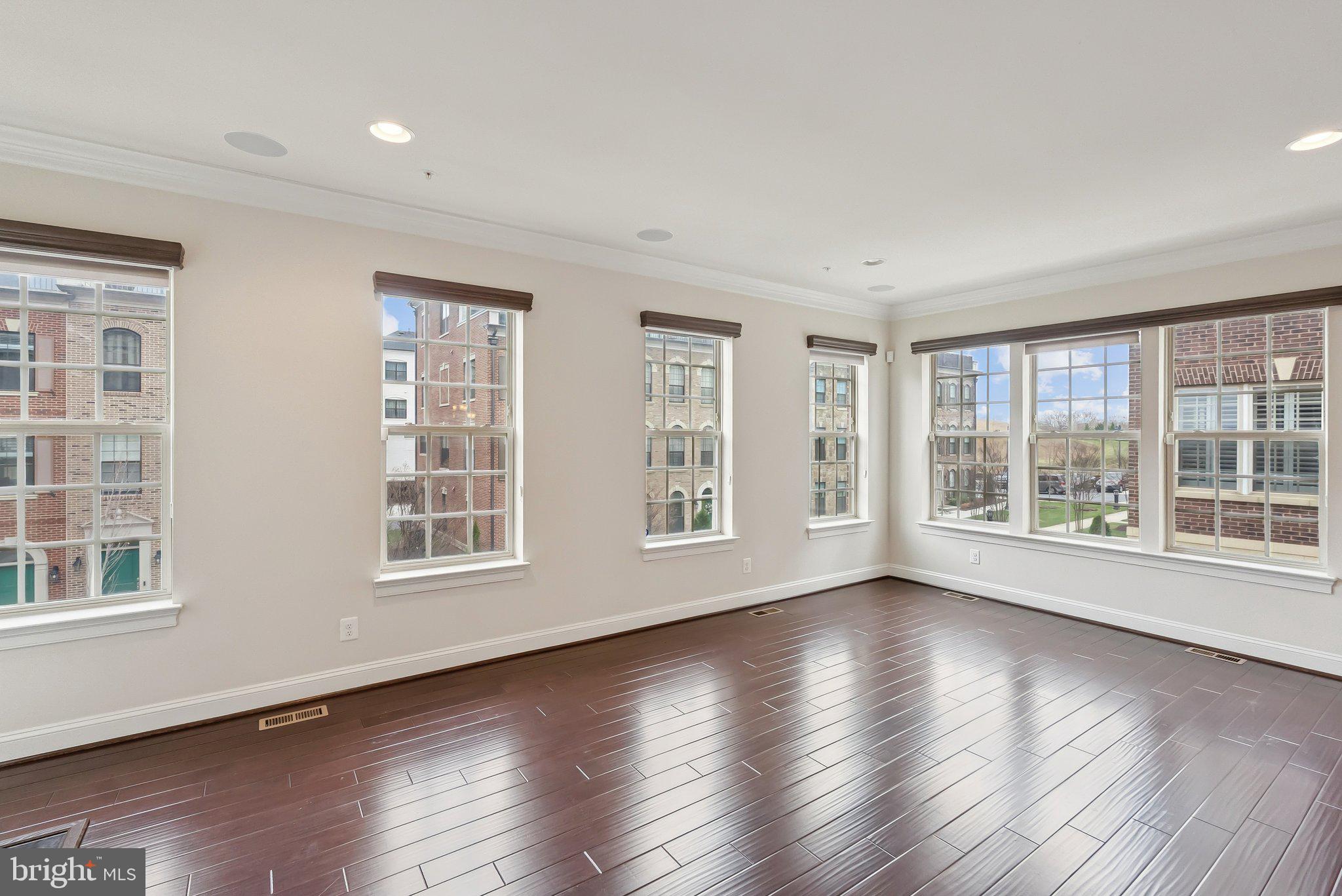 608 Fair Winds Way, Unit 262A Oxon Hill, MD 20745 - Photo 21 of 48 a view of an empty room with wooden floor and windows