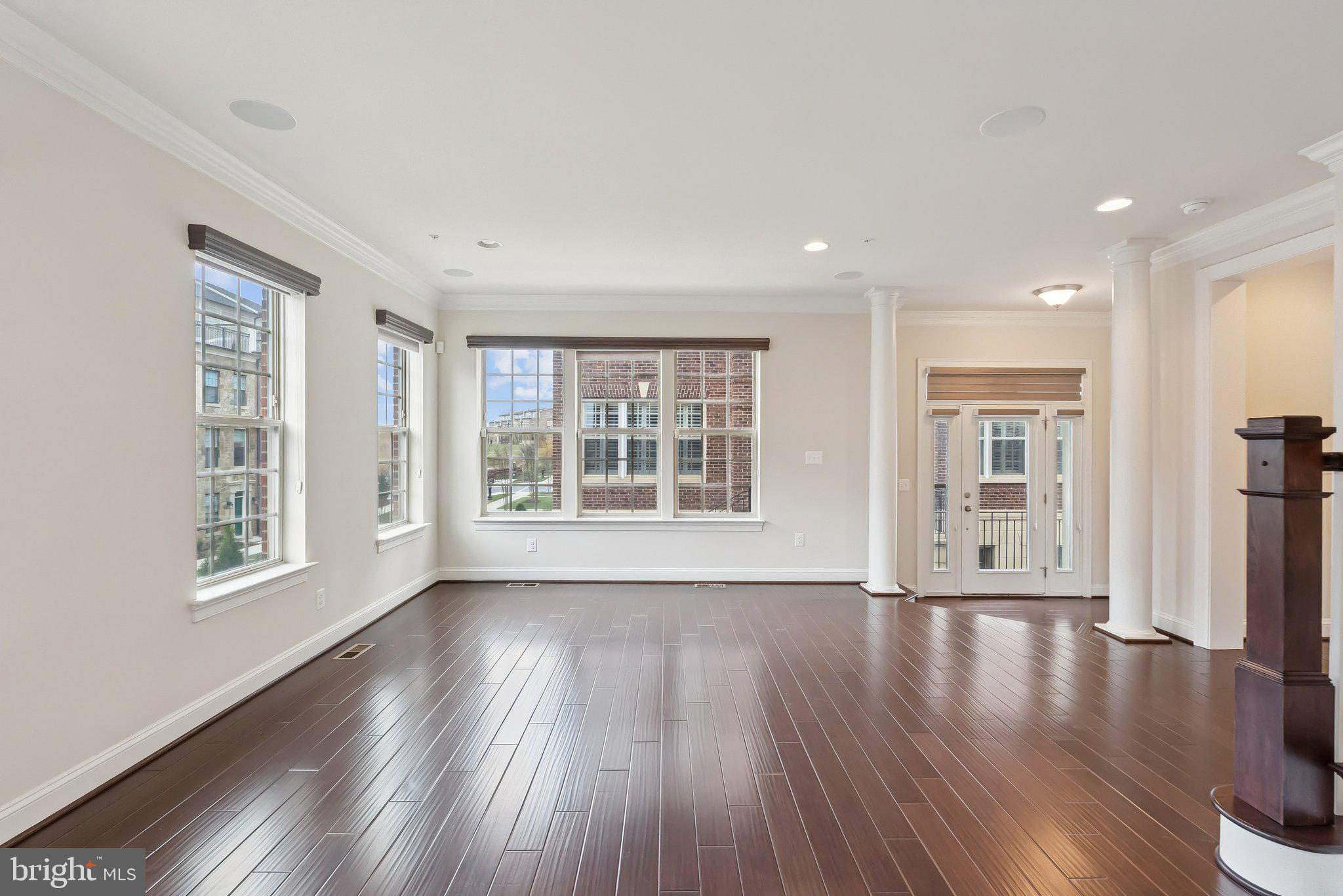 608 Fair Winds Way, Unit 262A Oxon Hill, MD 20745 - Photo 22 of 48 a view of an empty room with wooden floor and a window