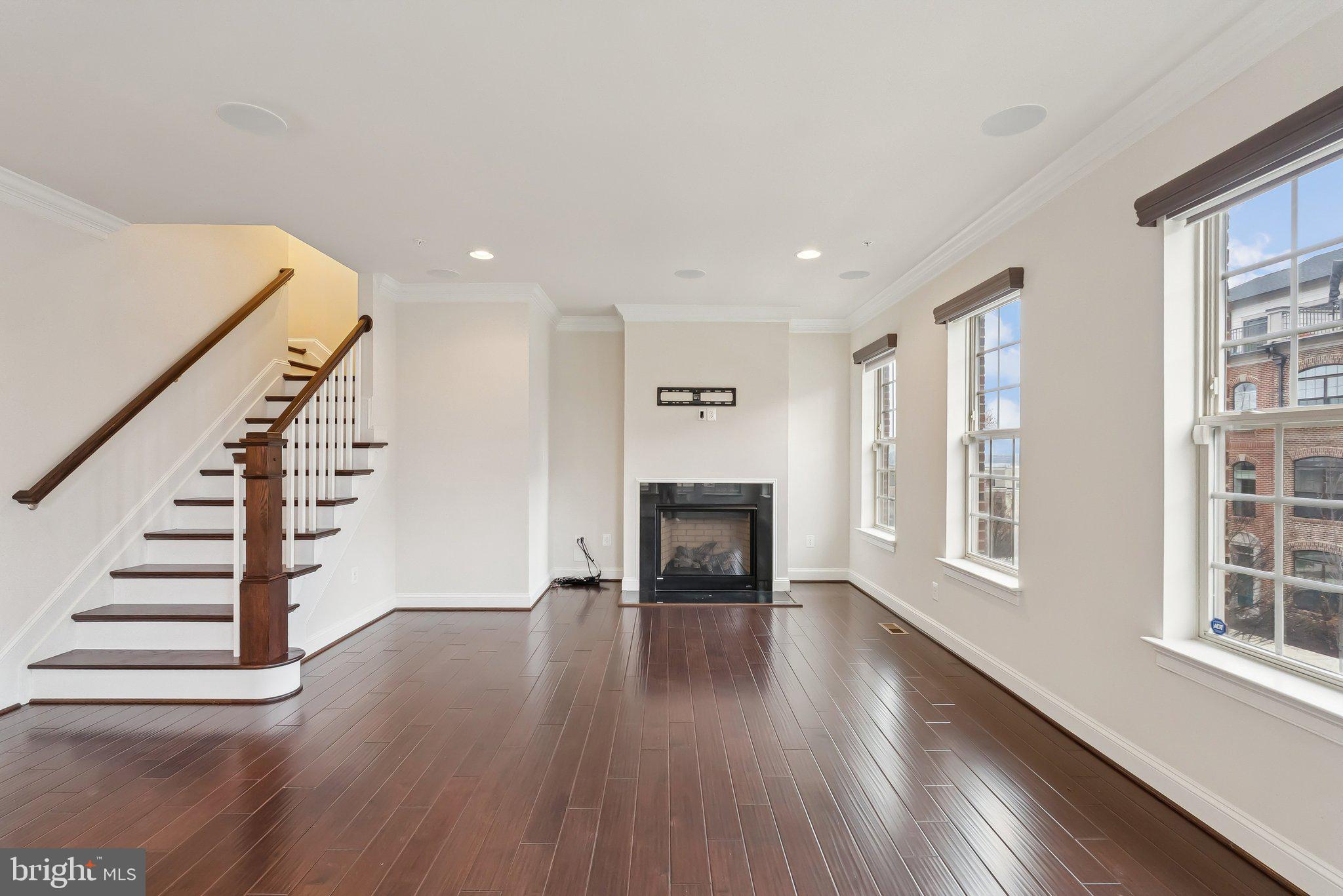 608 Fair Winds Way, Unit 262A Oxon Hill, MD 20745 - Photo 3 of 48 a view of an empty room with wooden floor and stairs