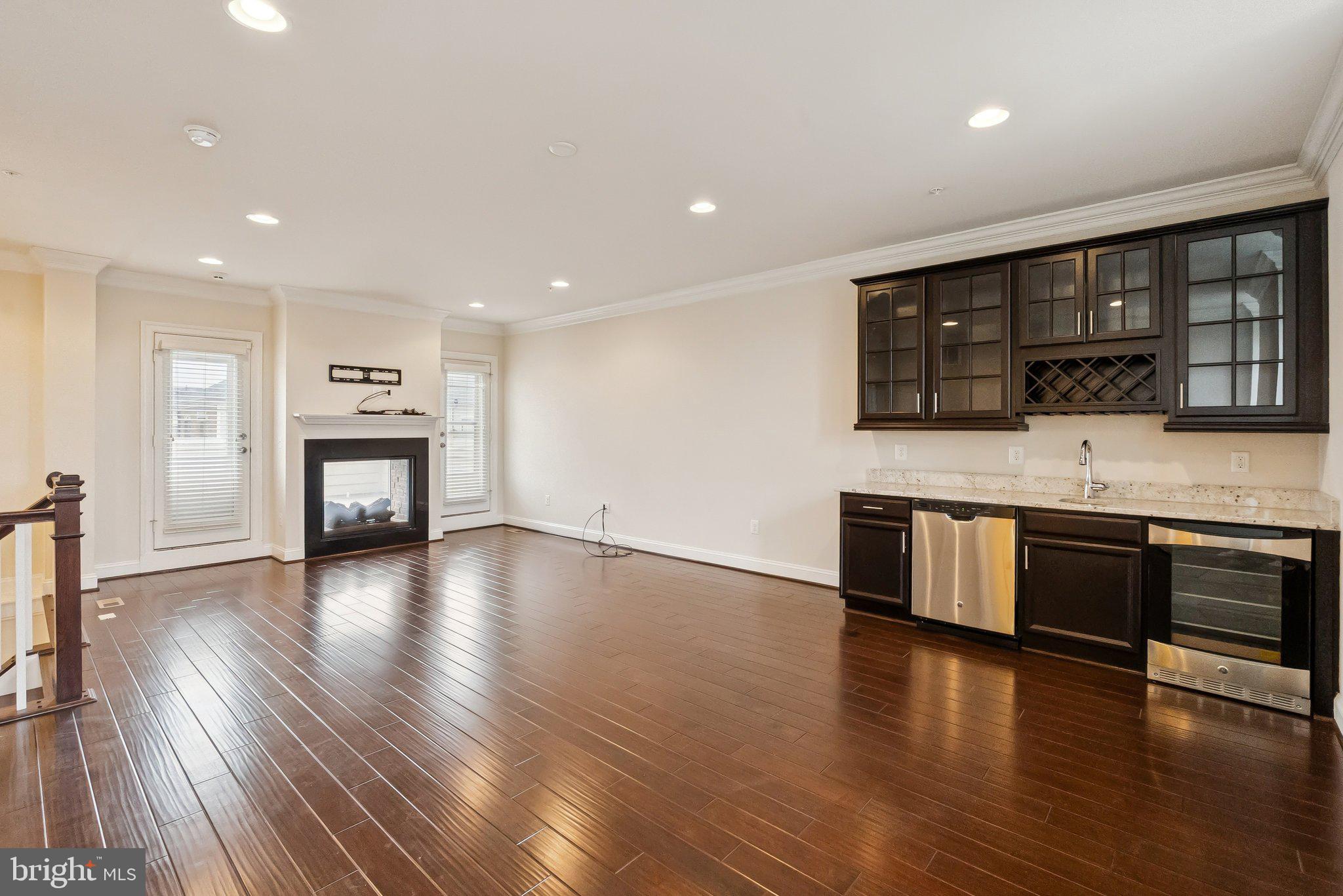 608 Fair Winds Way, Unit 262A Oxon Hill, MD 20745 - Photo 8 of 48 a large kitchen with stainless steel appliances granite countertop a stove and a wooden floors
