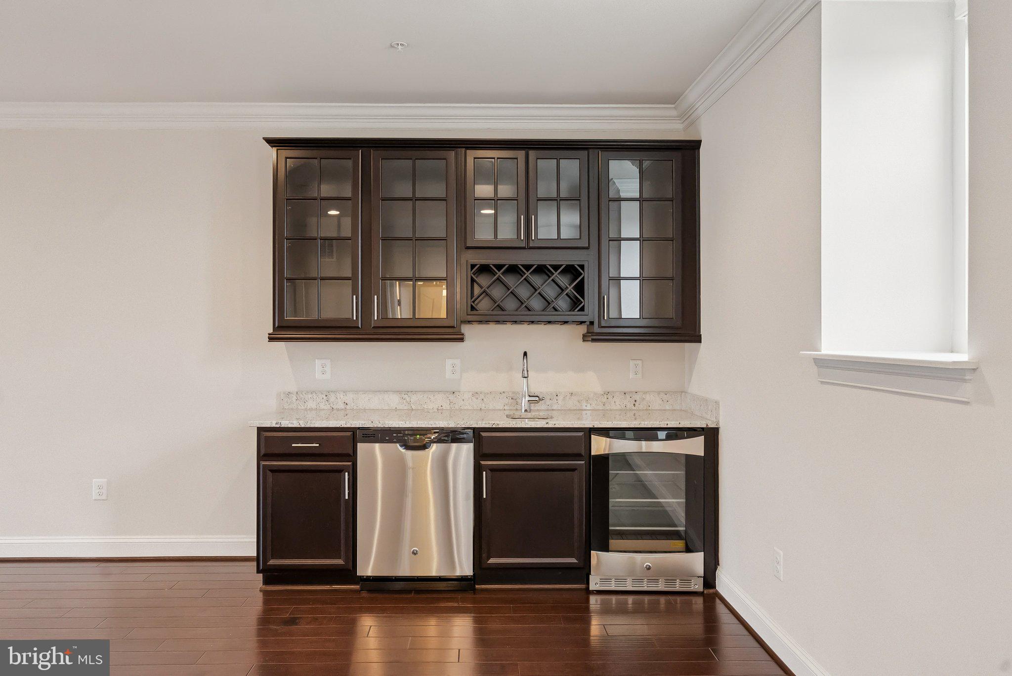 608 Fair Winds Way, Unit 262A Oxon Hill, MD 20745 - Photo 9 of 48 a kitchen with granite countertop a stove and a sink