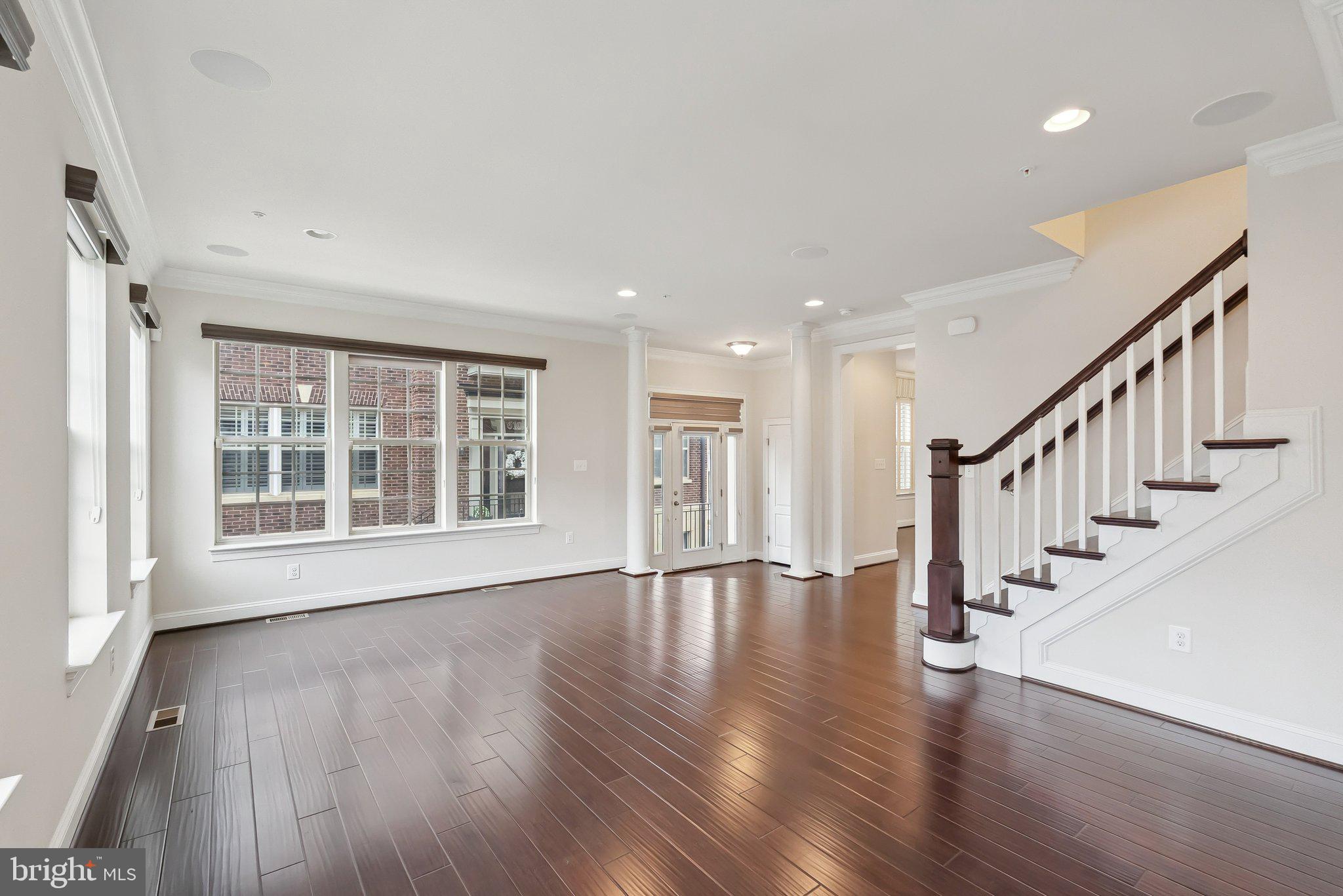 608 Fair Winds Way, Unit 262A Oxon Hill, MD 20745 - Photo 10 of 48 a view of an empty room with wooden floor and a window