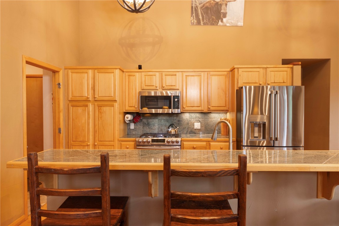 760 Penstemon Road Keystone, CO 80435 - Photo 10 of 39 a kitchen with a sink cabinets and outdoor space
