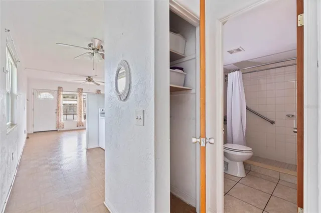 a spacious bedroom with a bed and a window