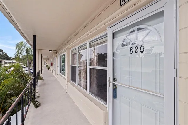 a view of a room with cabinet and ceiling fan