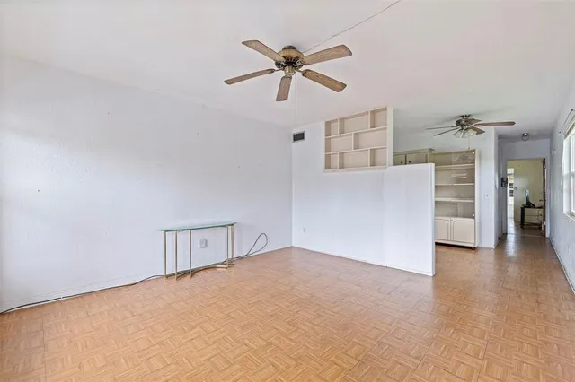 a view of an empty room with a window