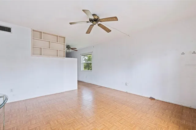 a view of an empty room with a window
