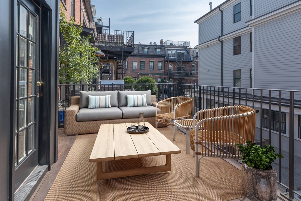 793 East 4th Street Boston, MA 02127 - Photo 13 of 17 a view of a roof deck with couches