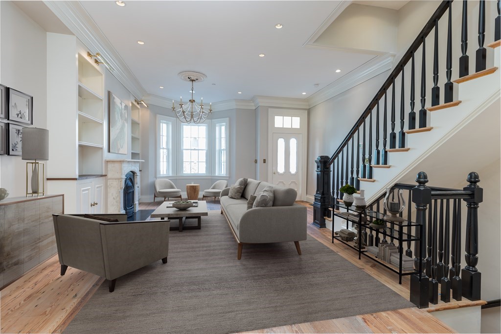 793 East 4th Street Boston, MA 02127 - Photo 15 of 17 a living room with furniture and a dining table