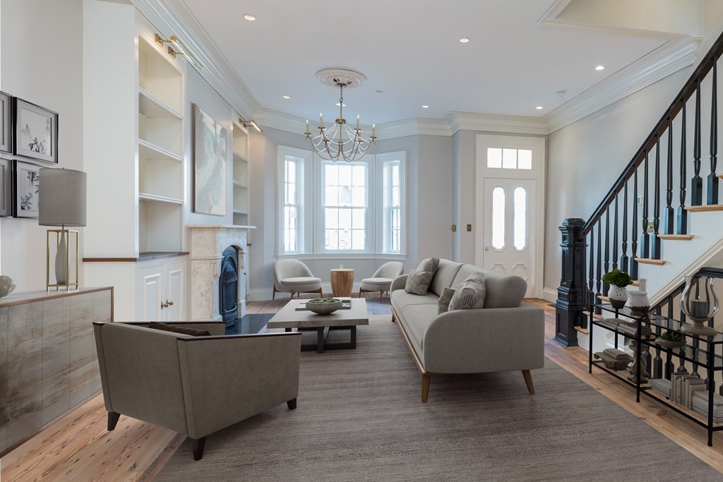 793 East 4th Street Boston, MA 02127 - Photo 17 of 17 a living room with furniture and a chandelier