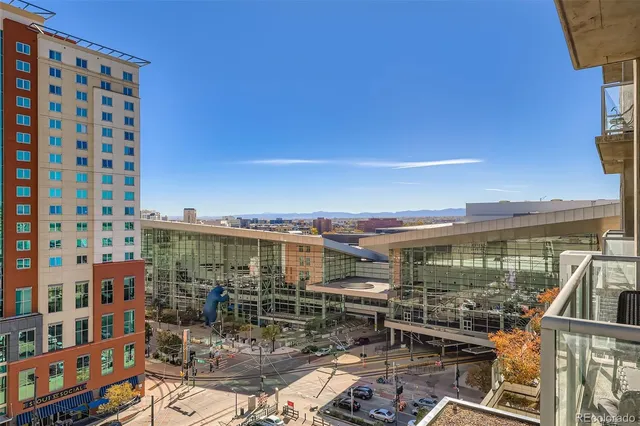 a view of a balcony with chairs