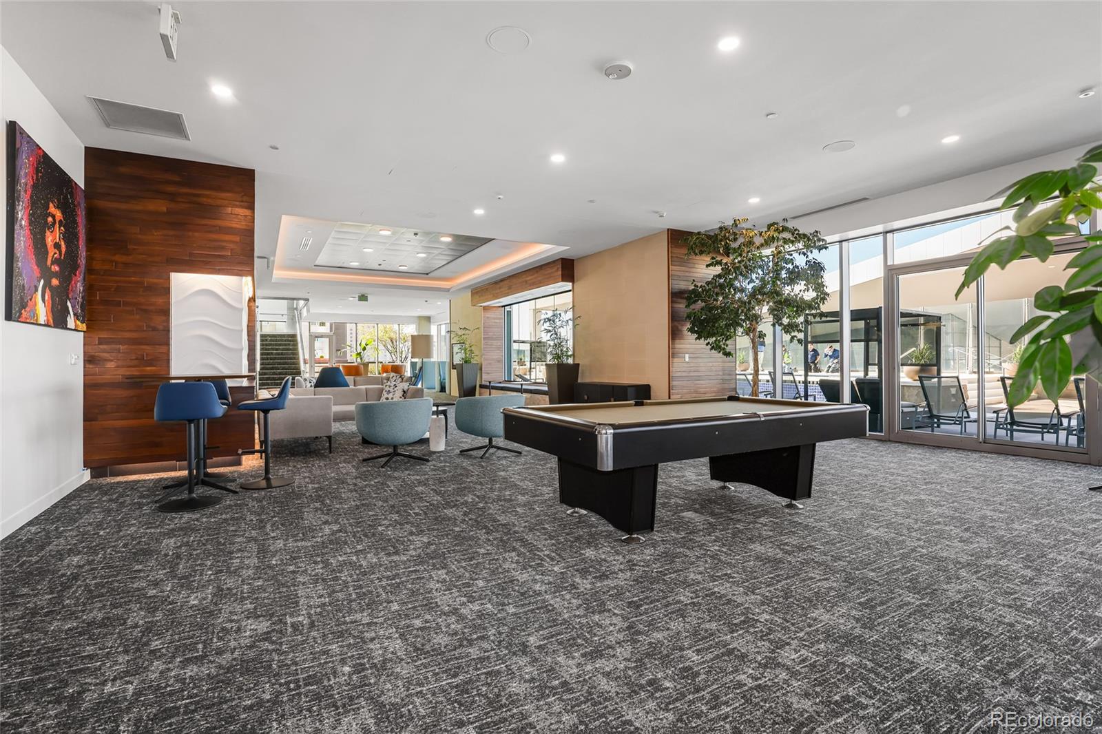 891 14th Street, Unit 1111L Denver, CO 80202 - Photo 22 of 39 a living room with furniture a rug and a fireplace