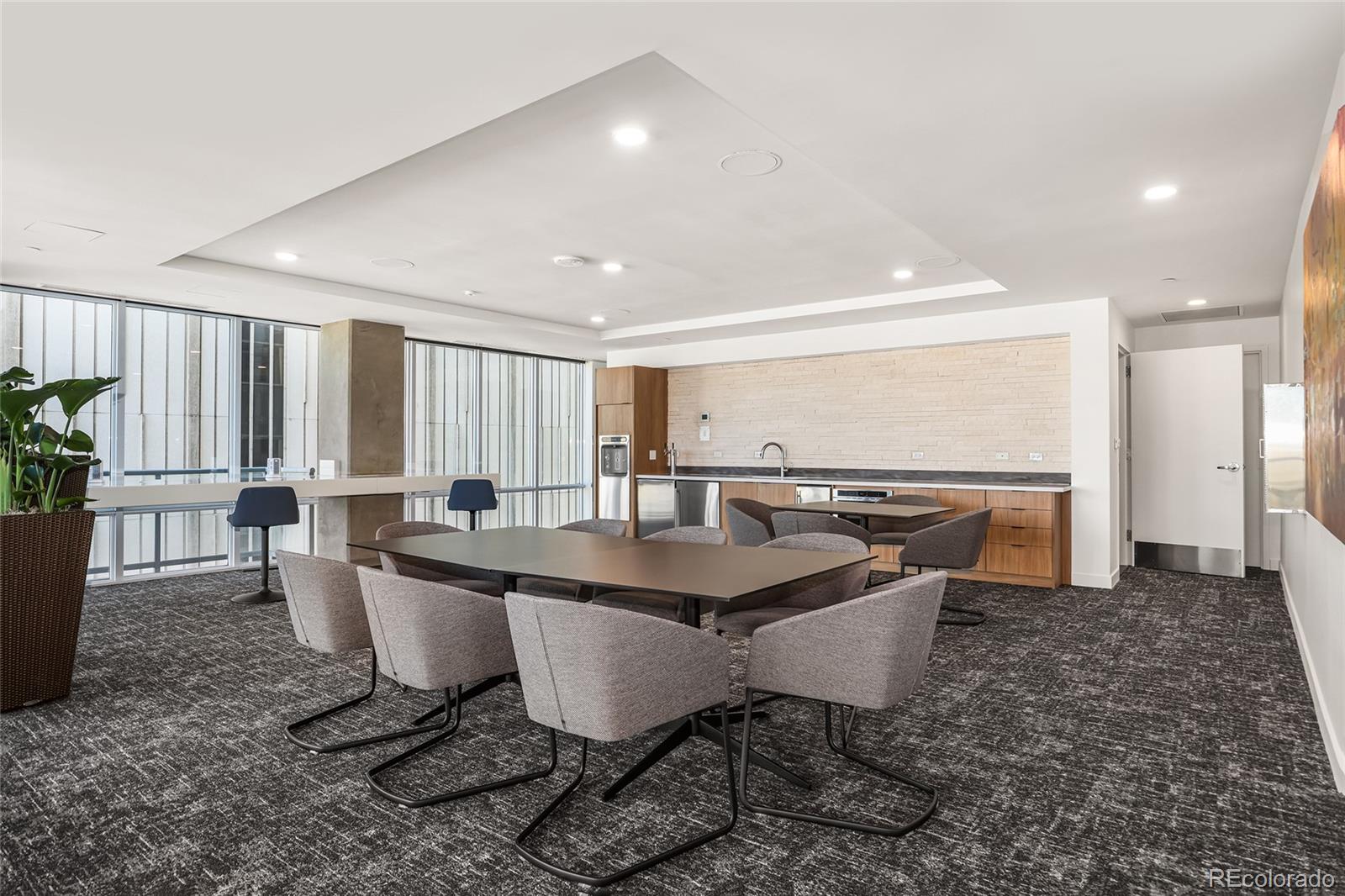 891 14th Street, Unit 1111L Denver, CO 80202 - Photo 31 of 39 a dining room with furniture and a floor to ceiling window