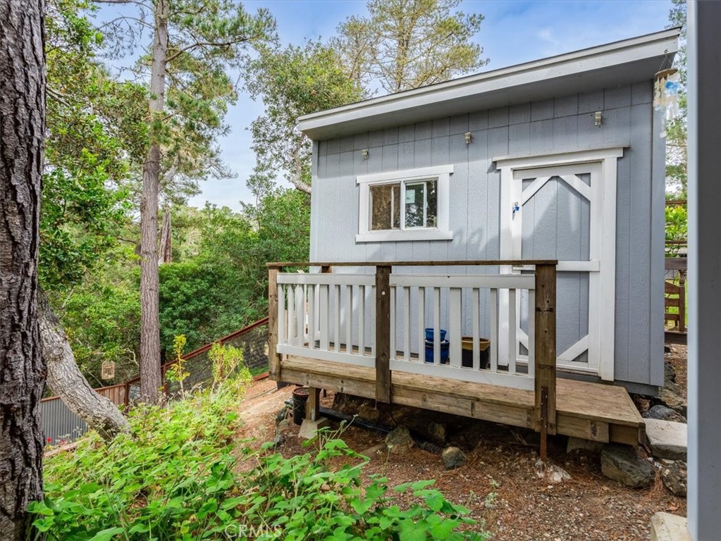1810 Melrose Avenue Cambria, CA 93428 - Photo 54 of 74 a view of a small house with a yard and wooden fence