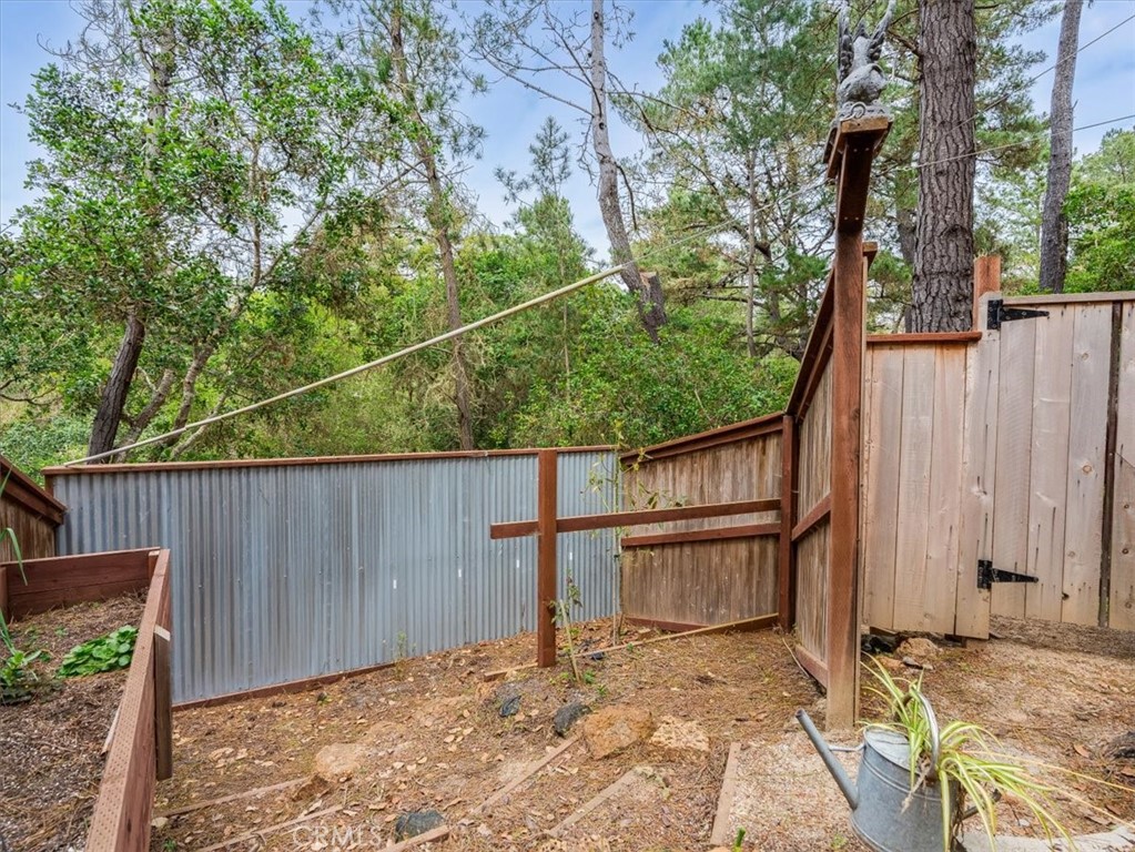 1810 Melrose Avenue Cambria, CA 93428 - Photo 60 of 74 a backyard of a house with wooden floor and outdoor seating
