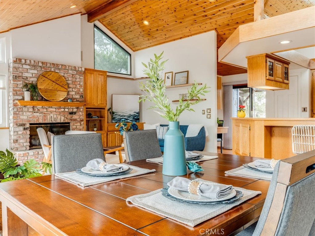 1810 Melrose Avenue Cambria, CA 93428 - Photo 8 of 74 a view of a patio with table and chairs potted plants