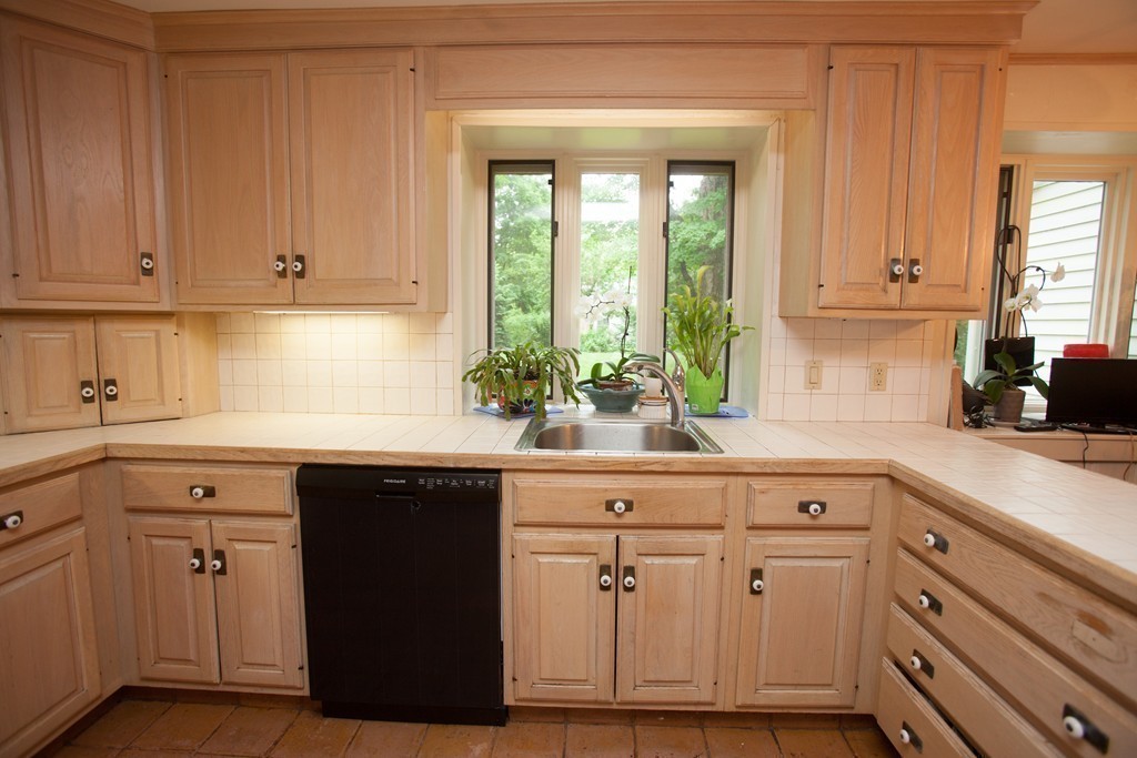 14 Dover Road Dover, MA 02030 - Photo 13 of 20 a kitchen with granite countertop white cabinets and sink