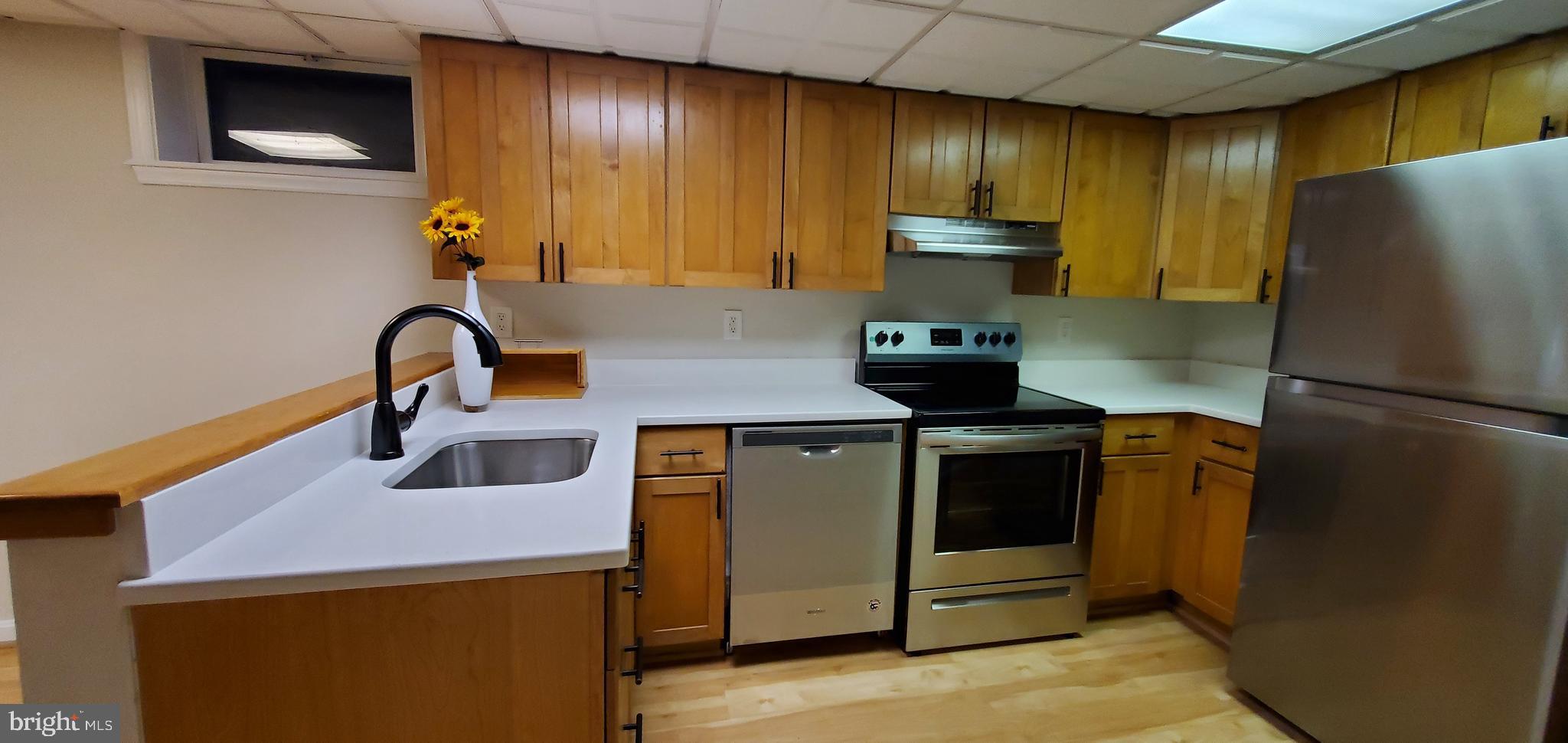 7641 Dollyhyde Road Mount Airy, MD 21771 - Photo 17 of 31 a kitchen with a refrigerator and a sink