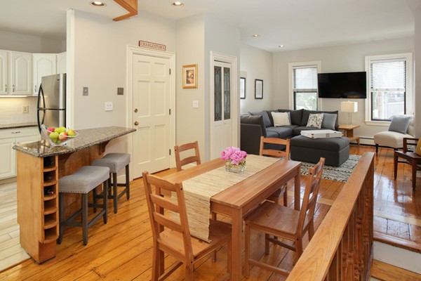 43 Russell Street, Unit 1 Boston, MA 02129 - Photo 2 of 6 a view of a dining room with furniture and a flat screen tv