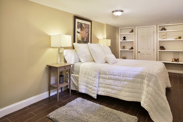 43 Russell Street, Unit 1 Boston, MA 02129 - Photo 3 of 6 a bedroom with a bed and a night stand