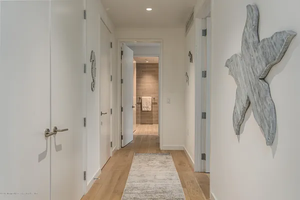 a view of a bathroom from a hallway